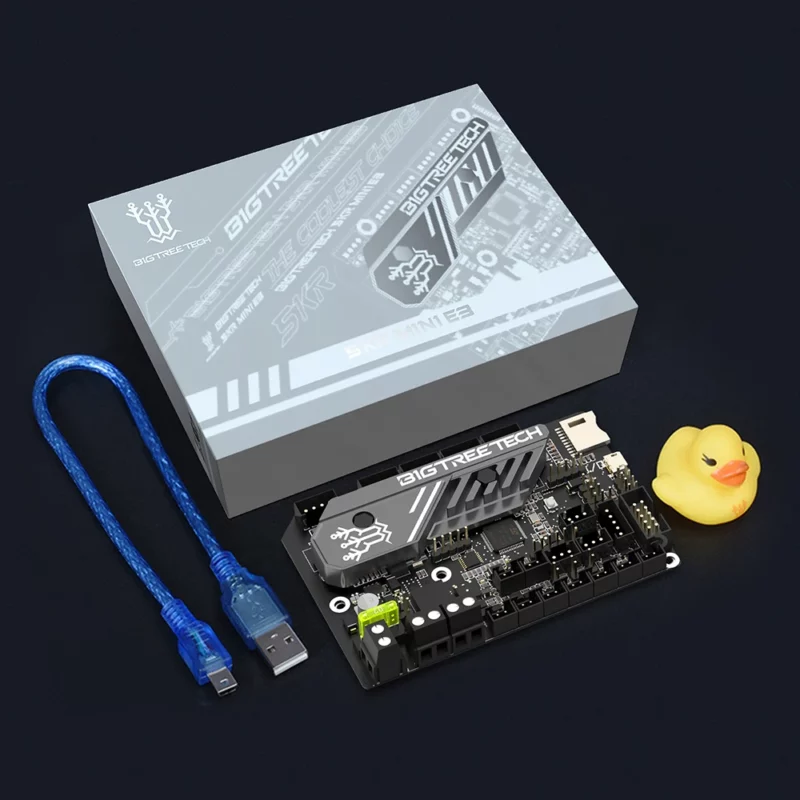 BigTreeTech BTT SKR MINI E3 V3.0 3D printer motherboard for Ender 3 upgrade, includes USB cable and a rubber duck.