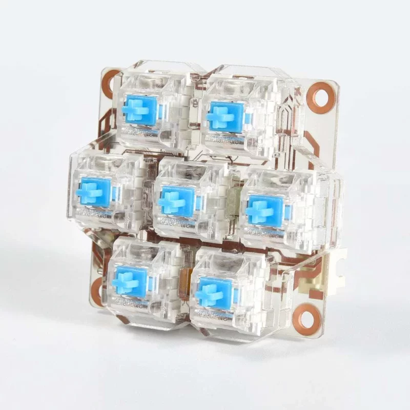 BigTreeTech HBB/HBB Fe: Mechanical keyboard switches with clear housing and blue stems, mounted on a PCB