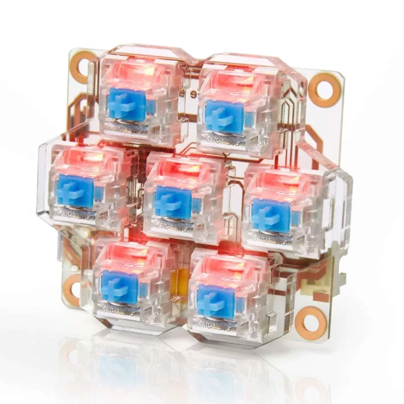 BigTreeTech HBB/HBB Fe key switch module with clear housings, blue stems, and red LEDs for mechanical keyboards