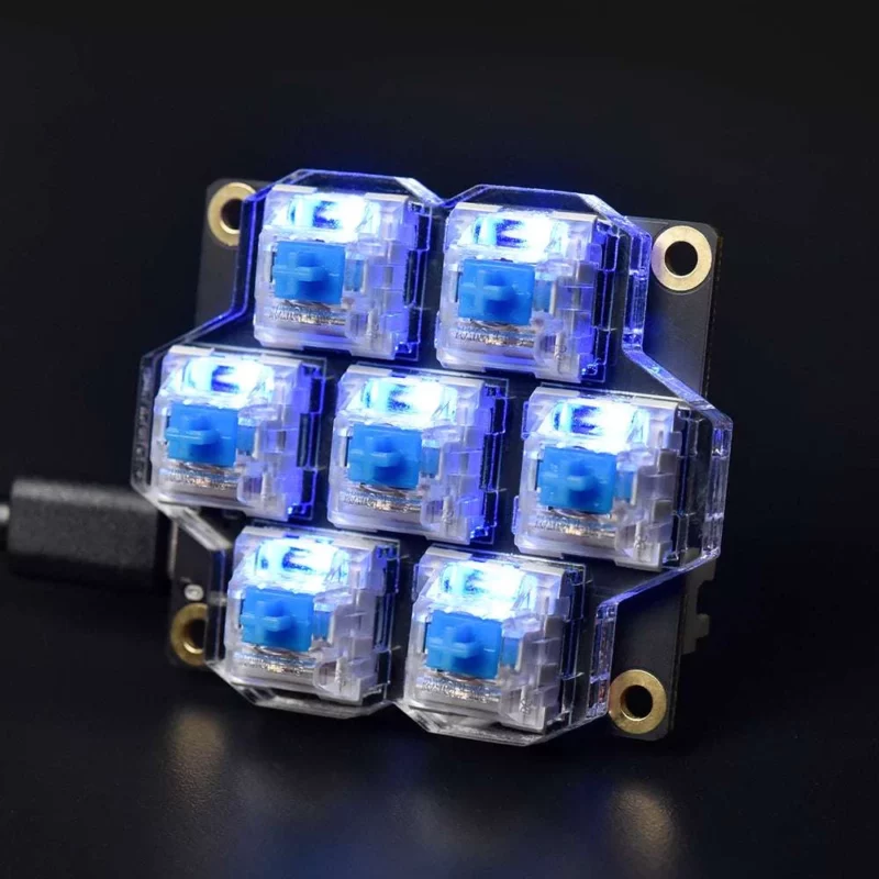 BigTreeTech HBB/HBB Fe: Illuminated blue mechanical keyboard switches mounted on a circuit board, ideal for custom builds.