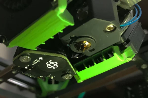 Beacon 3D Sensor Surface Scanner REV H. 3D printing sensor with green accents and circuit board. Beacon 3D Sensor for 3D printing.