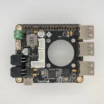 ToqueCAN circuit board: Black PCB with connectors, electronic components, and a central circular cutout.