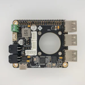 ToqueCAN circuit board: Black PCB with connectors, electronic components, and a central circular cutout.