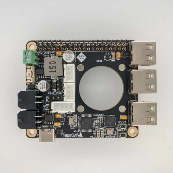 ToqueCAN circuit board: Black PCB with connectors, electronic components, and a central circular cutout.