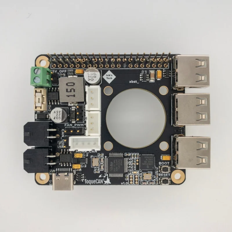 4430DA61 698A 4086 BFA4 32B3AE2D7953 2 ToqueCAN circuit board: Black PCB with connectors, electronic components, and a central circular cutout.