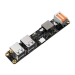 Black circuit board with two USB 2.0 ports, a USB-C port, and a terminal block connector.